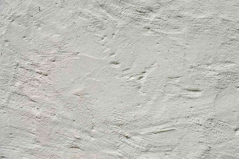 Surface de mur en plâtre avec éclairage naturel